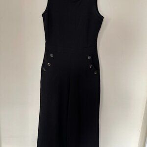 Black cotton sleeveless jumpsuit with pockets